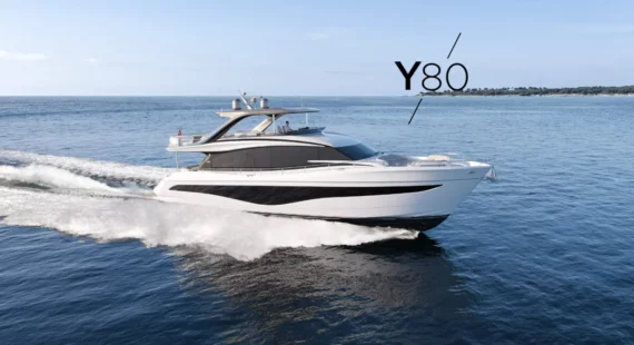 "Princess-y80" Stylish and powerful yacht Princess Y80 moving swiftly on calm seas, with a clear horizon in the background.